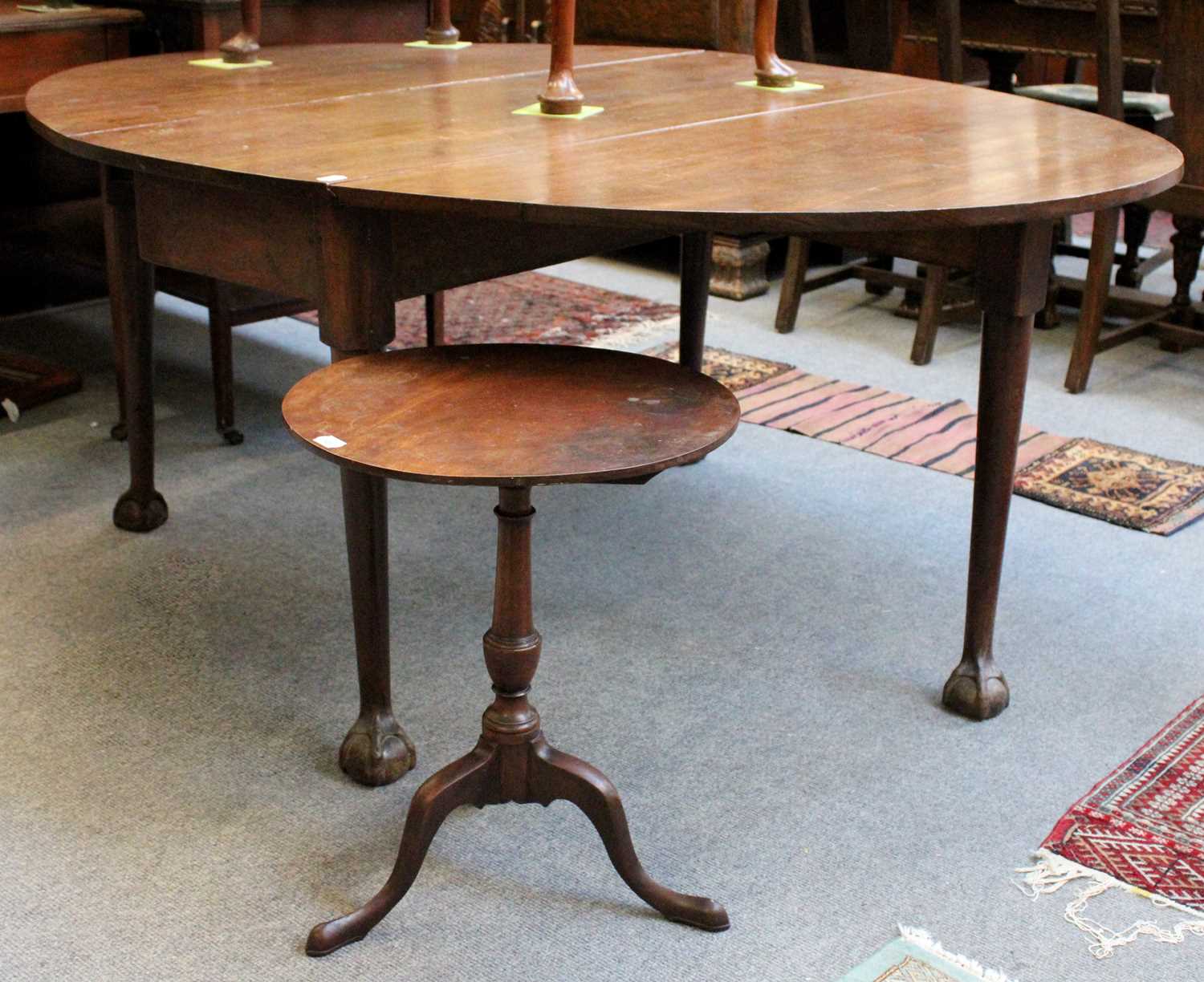 A Georgian Dropleaf Table, on ball and claw feet, 162cm by 126cm by 70cm and A 19th Century Mahogany