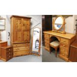 Pine Bedroom Furniture, to include: A Wardrobe, A Dressing Table, A Dressing Stool and Mirror, A