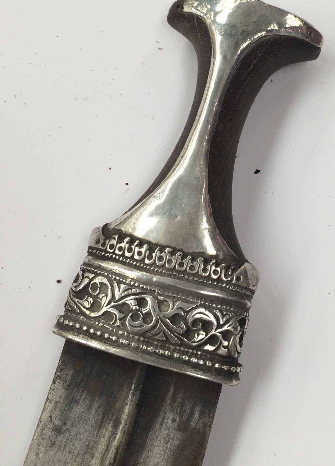 A 19th Century Omani Khanjar, the 16cm double edge curved steel blade with raised medial ridge, - Image 4 of 10