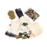 A Quantity of Militaria, including British Second World War and post-War buttons, cap badges,