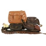 A Quantity of Gun Accessories, comprising three leather cartridge bags, a vinyl game bag, two