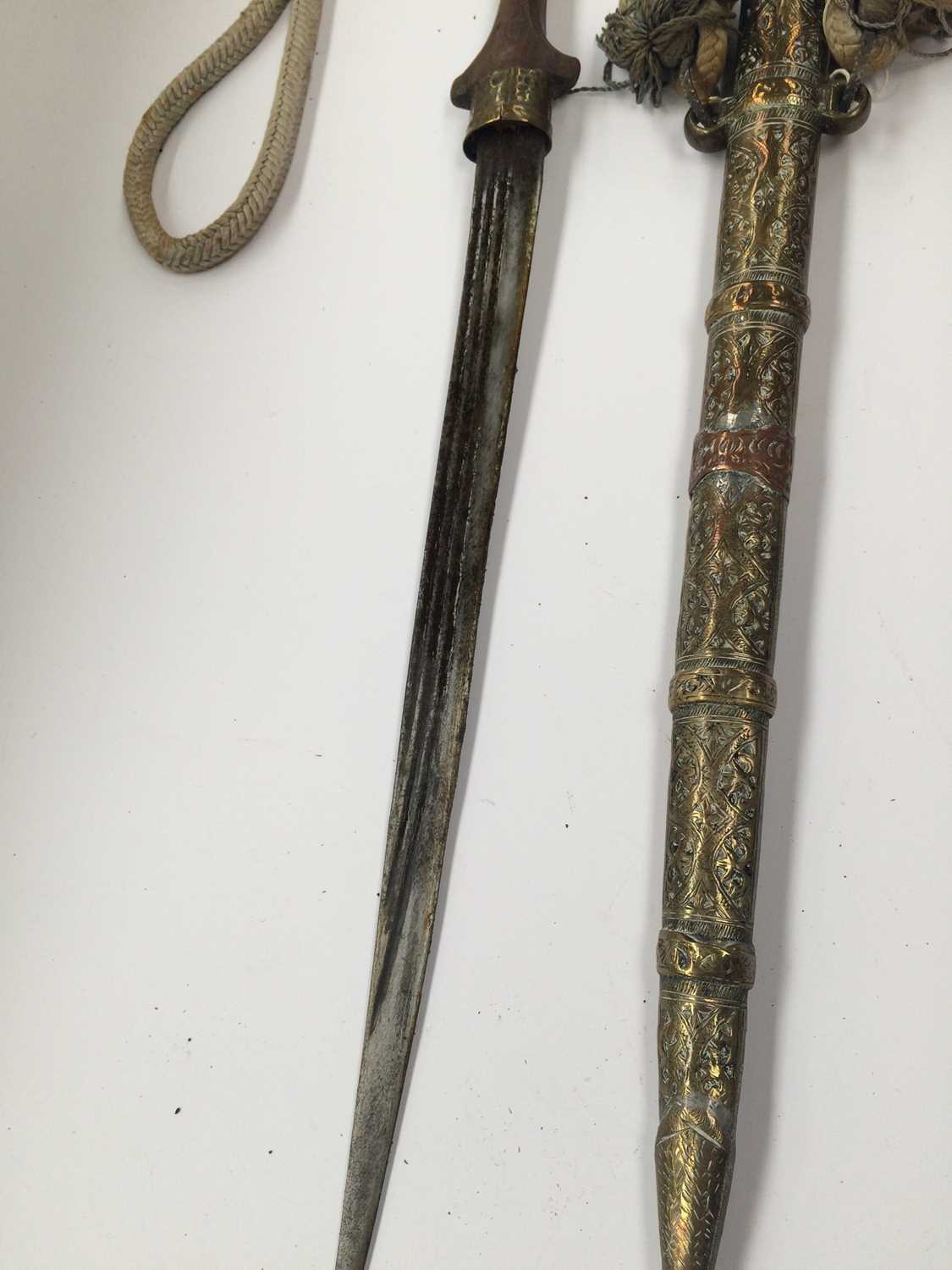 A 19th Century Omani Khanjar, the 16cm double edge curved steel blade with raised medial ridge, - Image 5 of 10
