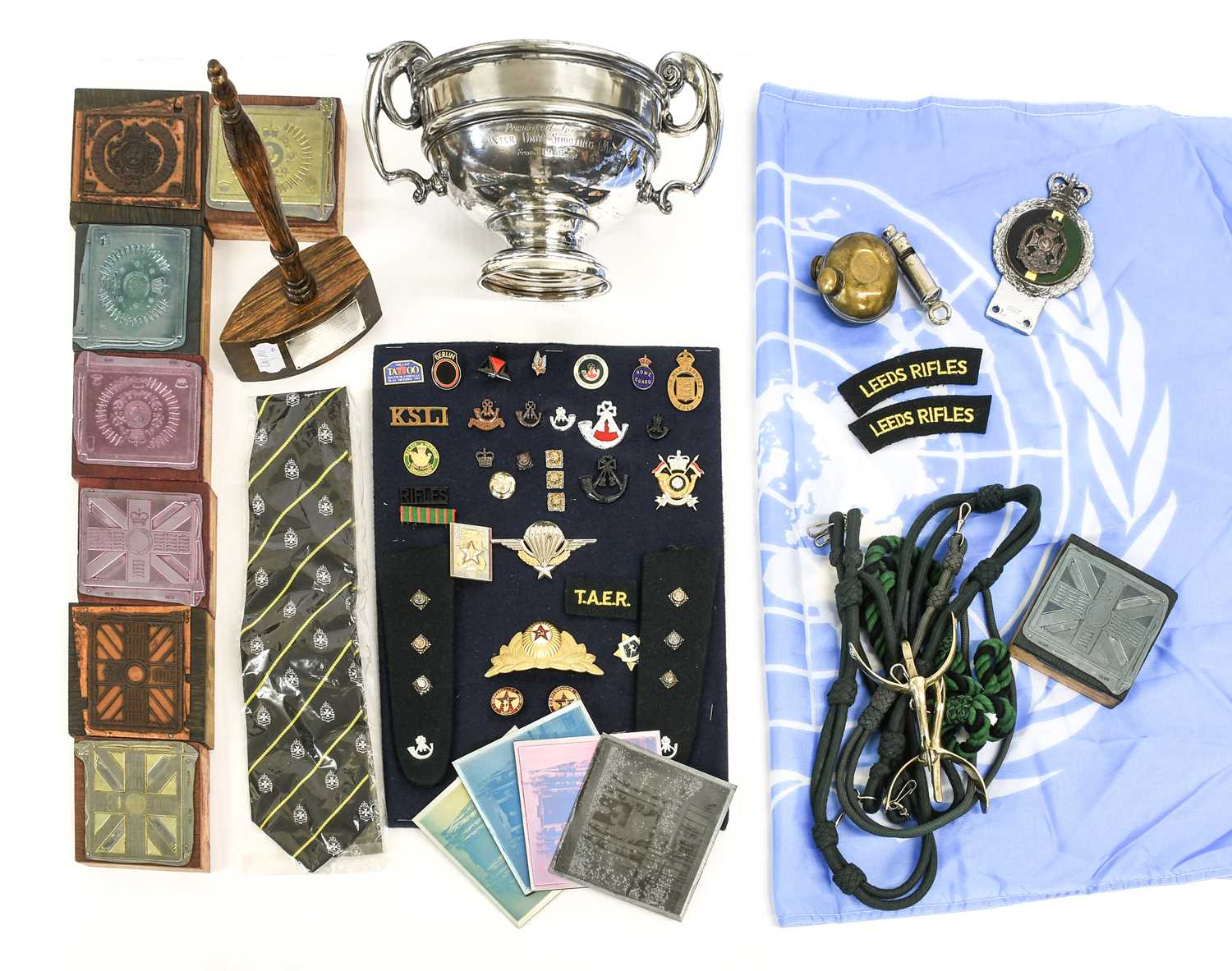 A Quantity of Militaria, including items related to the Leeds Rifles comprising a car badge, tie,