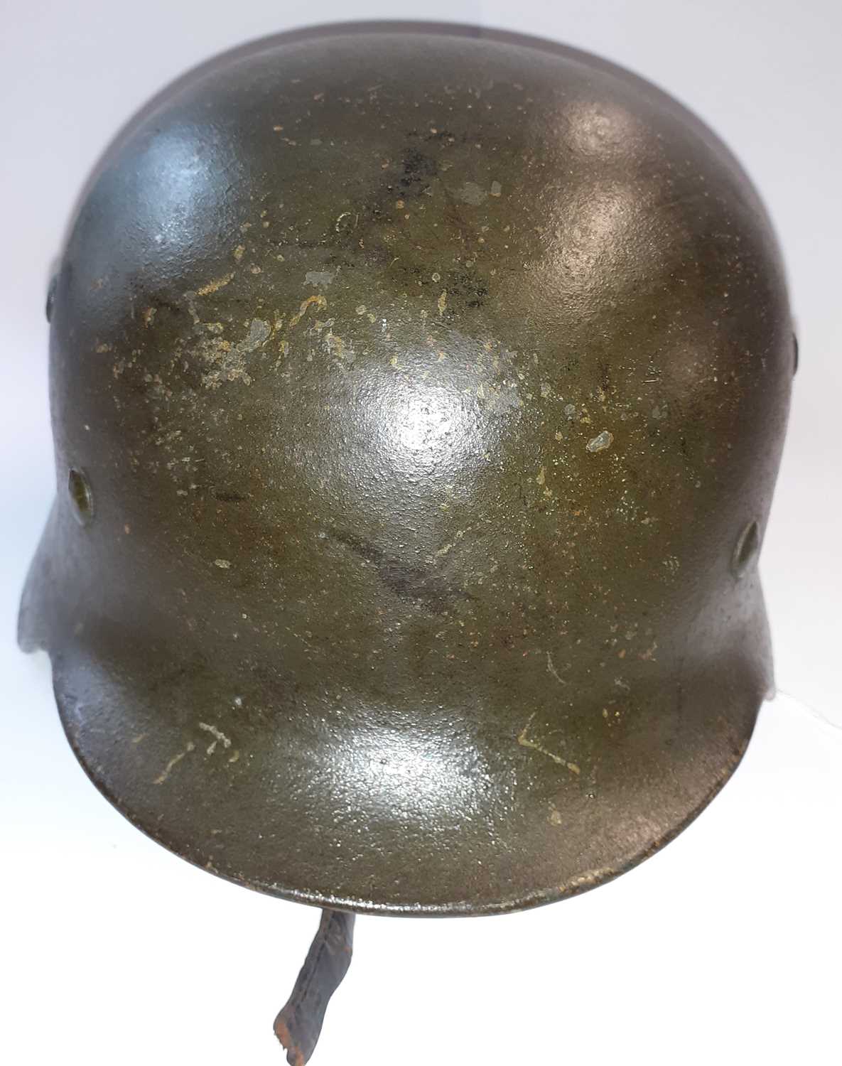 A Second World War Geman M35 Combat Helmet, with dark green finish, later Heer decal, folded rim, - Image 4 of 9