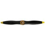 A Black Painted Laminated Wood Aeroplane Propeller, each blade with yellow painted tip and metal