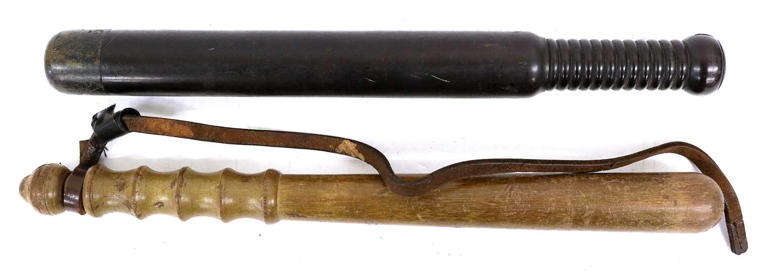 A Victorian Ebony Police Truncheon, the weight brass head engraved VR/133, the lower section of