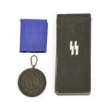 A German SS 4 Year Service Medal, with blackened finish, blue ribbon and in black cardboard box, the
