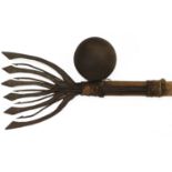 A 9 Pounder Cannon Ball; a 19th Century Eel Spear, with alternating spear-head and barbed tines,