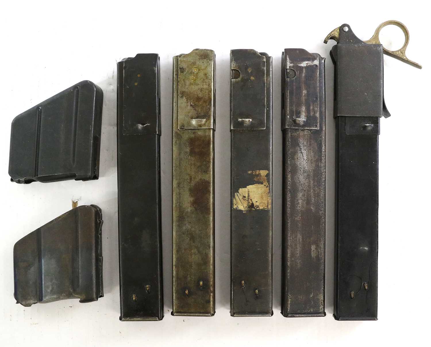 A Collection of Sixteen Sten Gun Magazines, together with a speed loader and three SMLE .303