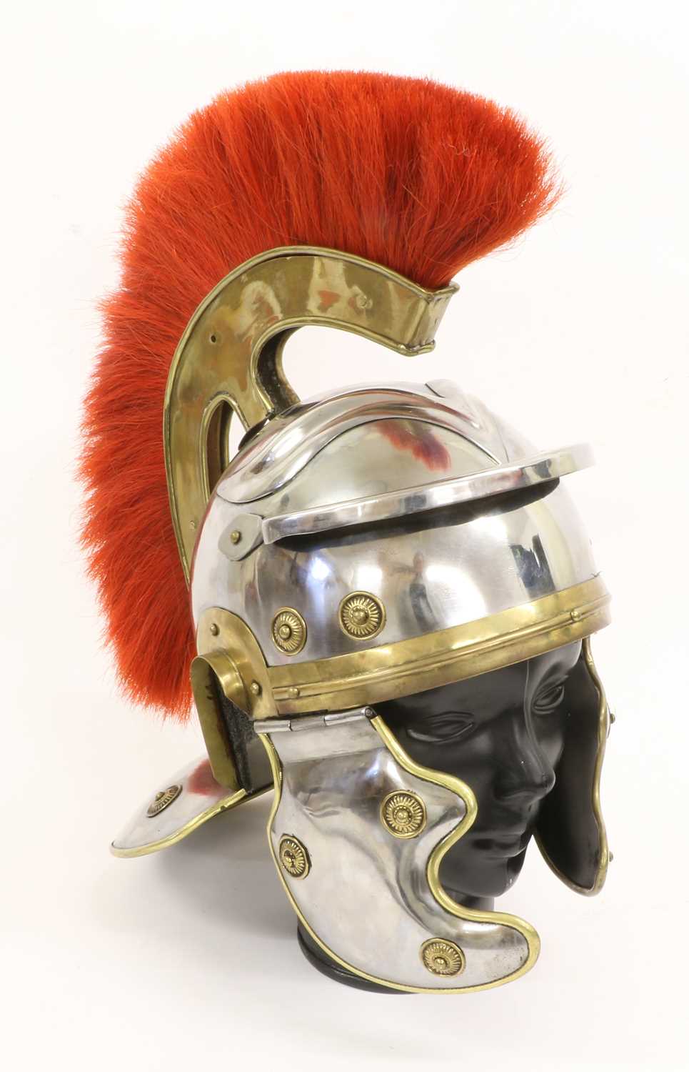 A Copy of a Roman Centurion's Helmet, in steel, with red horsehair and brass comb, brass edging