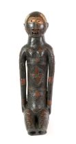 A Large Kouyou/Kuyu Dark Terracotta Fetish Figure, Kuyu River Region, N.W. Congo, seated with long