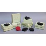Penhaligon's London Miniature Leather Folding Photo Frame Keyrings, five in black and one in red,