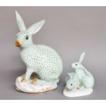 A Herend Porcelain Model of a Hare, green ground and on scroll moulded base, printed mark, 30cm
