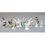 A Collection of Ceramic Bird Models, including: a pair of French faience swans, Wien golden