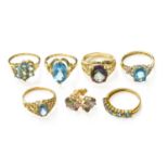 Five 9 Carat Gold Blue Topaz Rings, of varying designs and sizes; together with A 9 Carat Gold