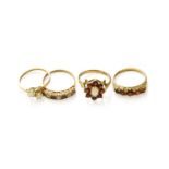 Four 9 Carat Gold Opal and Garnet Rings, varying designs and sizesGross weight 8.6 grams.