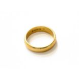 A 22 Carat Gold Band Ring, finger size L1/2Gross weight 6.0 grams.