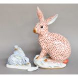 A Herend Porcelain Model of a Hare, red ground, and on scroll moulded base, printed mark, 30cm high,