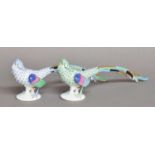 Two Herend Porcelain Models of Golden Pheasants, one blue ground, the other green, printed marks,