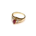 A Synthetic Ruby and Diamond Ring, stamped '18KT', finger size M1/2Gross weight 5.0 grams.