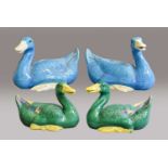A Pair of 20th Century Chinese Blue Models of Ducks together with A Further Pair, glazed in green