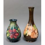 A Walter Moorcroft Coral Hibiscus Vase and A Walter Moorcroft Hibiscus Vase (2)Vases are 33cm and