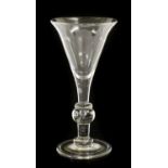 A Baluster Goblet, the conical bowl over an angular knop and a ball knop with air tear, the plain
