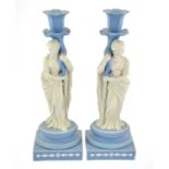 A Pair of Wedgwood Jasper Figural Candlesticks, circa 1810, modelled as Pomona and Ceres standing