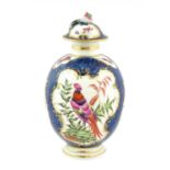 A Worcester Porcelain Tea Canister and Cover, circa 1775, of ovoid form, painted with exotic birds