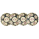 A Set of Four Worcester Porcelain Soup Plates, circa 1775, painted with flowers in panels on a