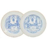 A Pair of English Delft Plates, circa 1760, painted in blue with European figures within chinoiserie