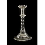 A Glass Taperstick, circa 1780, on a faceted stem and foot15.5cm highNumerous small chips around the