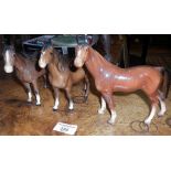 Two Beswick china horses and another