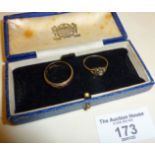 Two 9ct gold rings in an old jewellery case, approx. weight of rings 4.5g