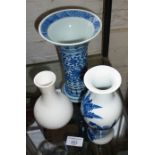 Chinese blue and white moulded vase, 22cm high and two others