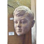 Terracotta bas relief bust of a young John F. Kennedy