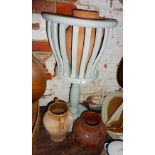 Painted wood planter on stand and three terracotta pots