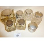 Seven antique inkwells, most cut glass with hallmarked silver lids, and another travel inkwell