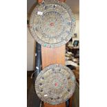 Pair of old Tibetan embossed brass mounted round plaques with turquoise and red stone insets