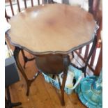 Edwardian mahogany shaped top 6 legged occasional table