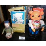 Schuco tin plate clockwork toy clown drummer and a battery-powered Bear with flash camera