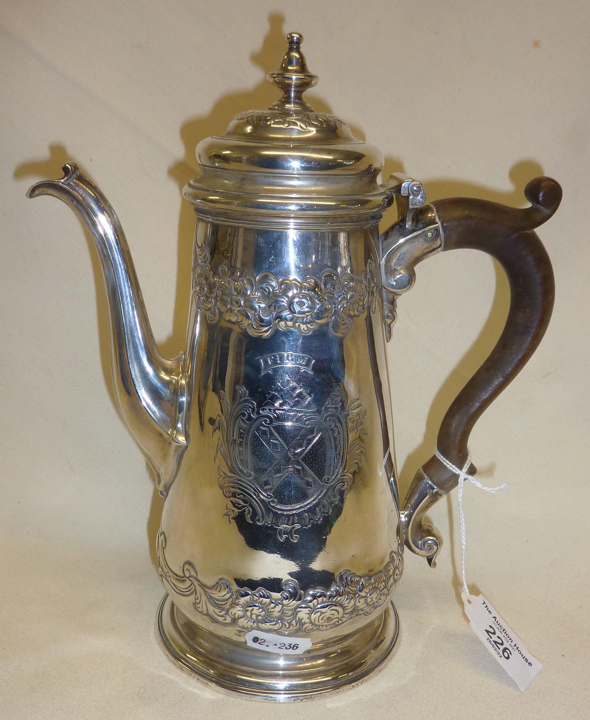 Heavy Georgian Sterling silver coffee pot with repoussé decoration. Hallmarked for London 1742,