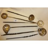 Five Sterling silver toddy ladles, four with inset coins to bowls, and one A/F