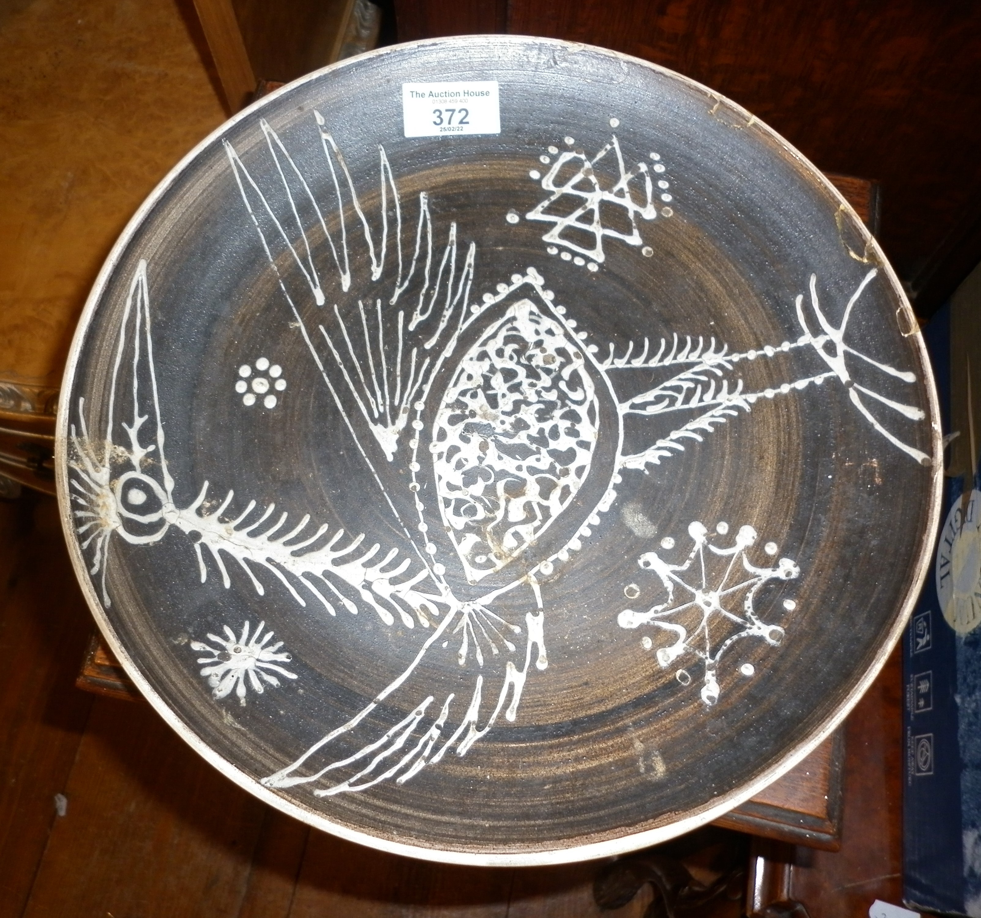 Abstract slipware plate after Picasso (A/F), 12" diameter