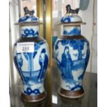 Pair Chinese crackle ware blue and white vases with covers, 21cms