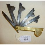 Antique brass cased medical tool fleam blades for blood letting - blades marked as TILY