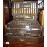 A Mappin & Webb oak canteen of silver plated cutlery having fitted interior, two drawers and