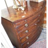 Georgian mahogany bow front chest of drawers with brushing slide standing on splayed bracket feet,