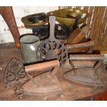 Iron and brass kitchen scales with weights, three flat irons, trivets etc