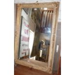 Wall mirror in ornate frame, 47" x 29"